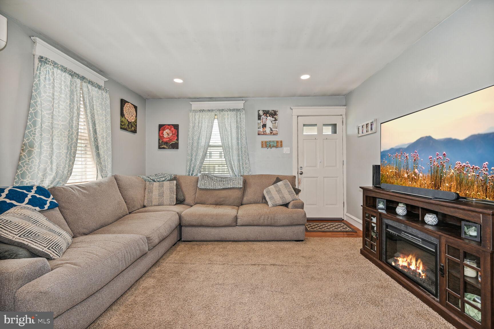 48 Haverford Road Runnemede, NJ 08078 - Photo 4 of 23 a living room with furniture and a flat screen tv