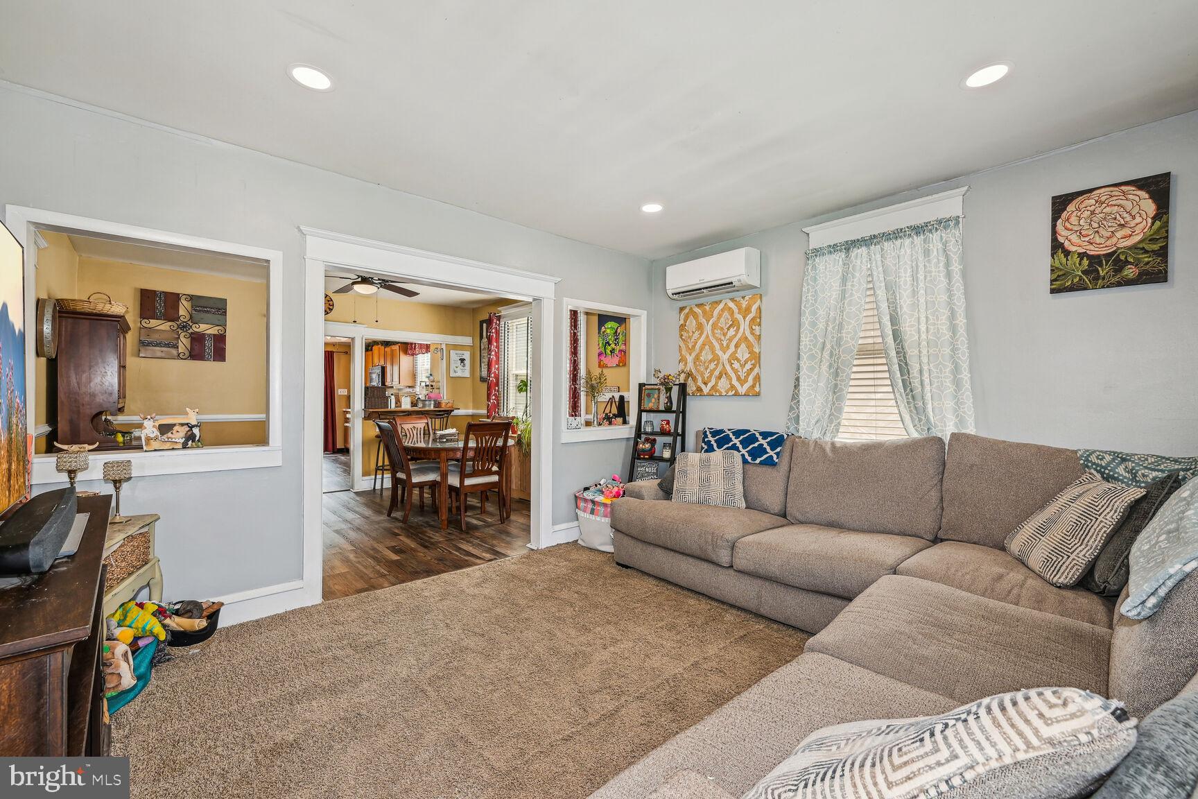 48 Haverford Road Runnemede, NJ 08078 - Photo 5 of 23 a living room with furniture and a dining table with kitchen view