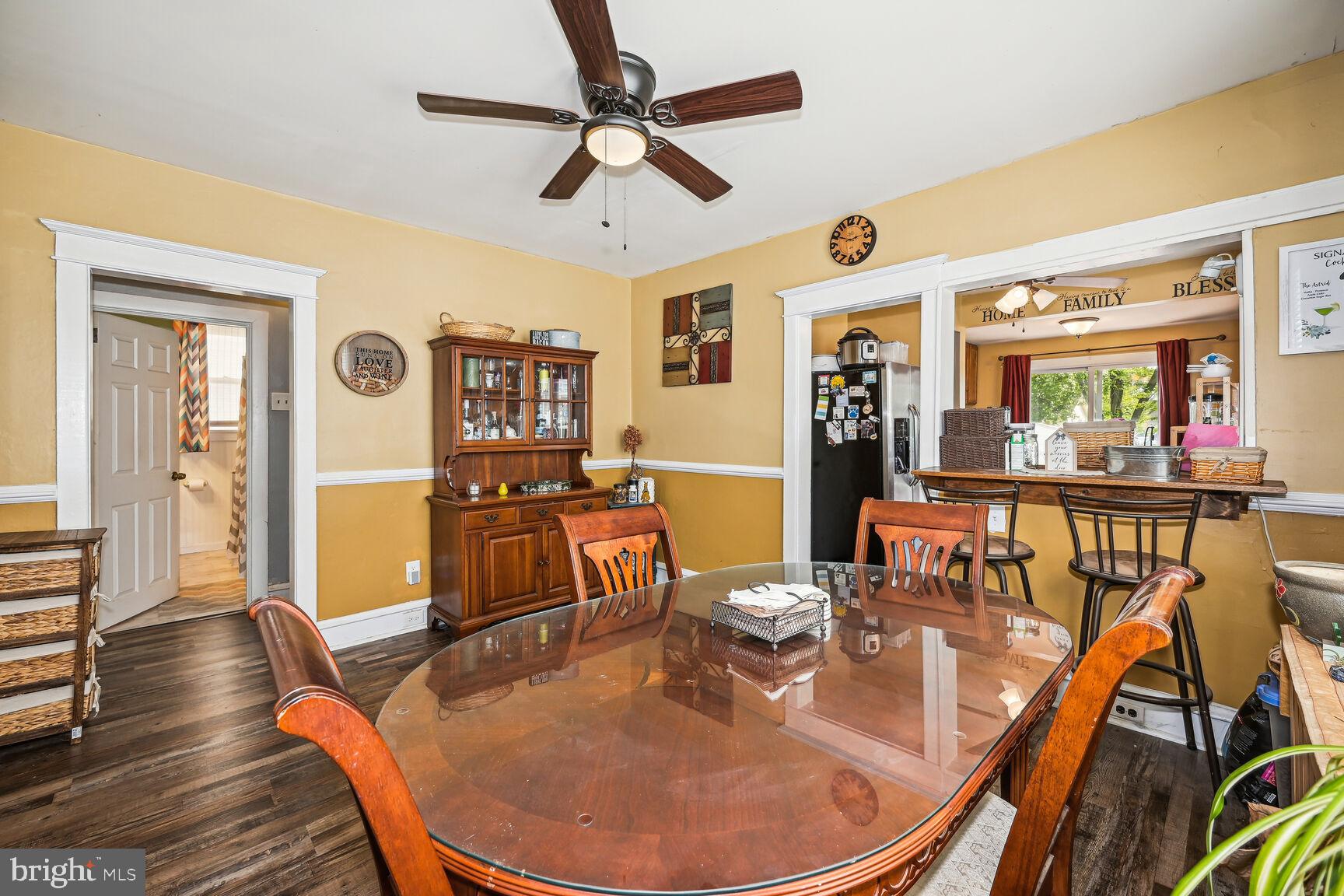 48 Haverford Road Runnemede, NJ 08078 - Photo 7 of 23 a dining room with wooden floor and large windows