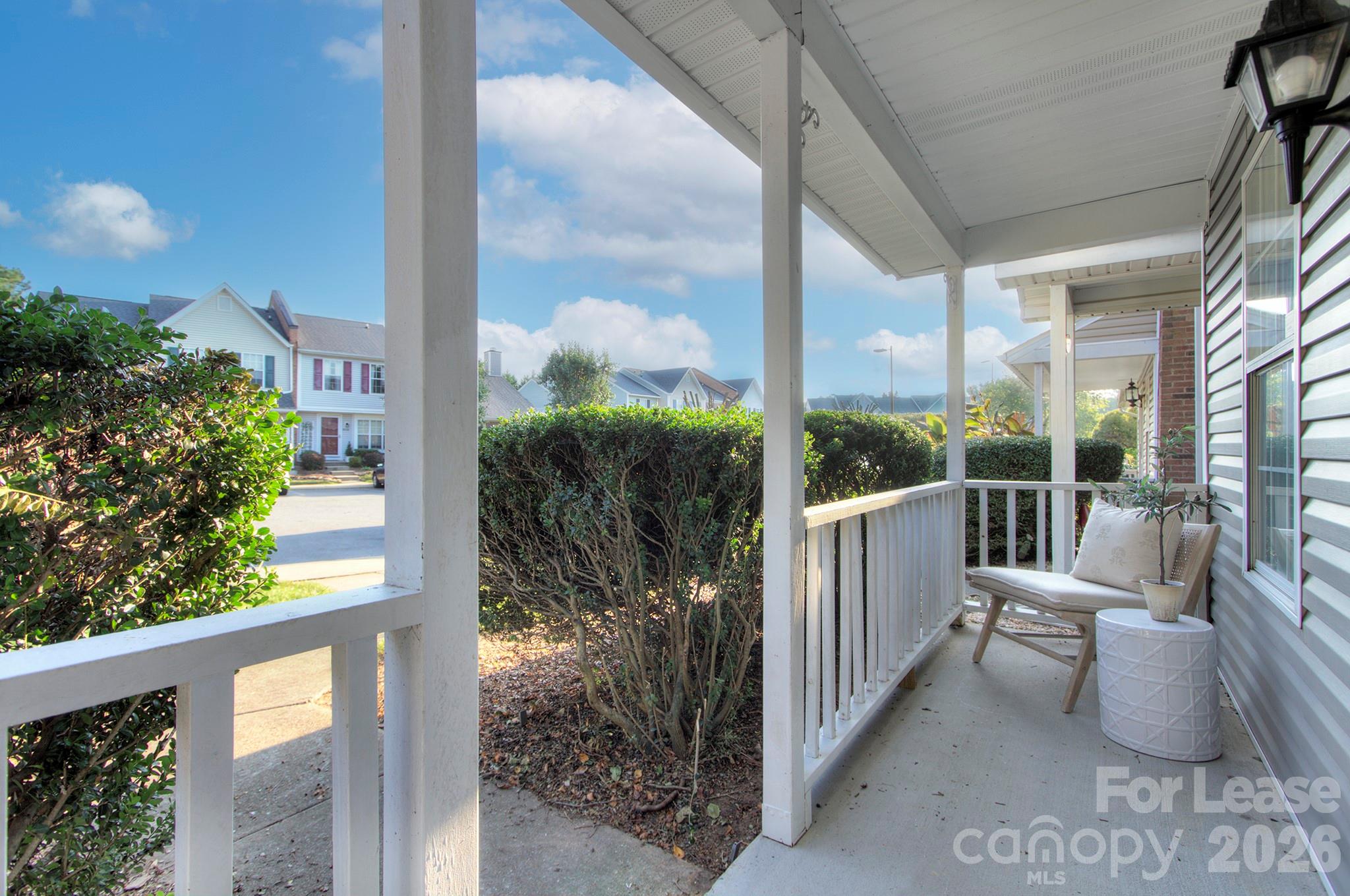 8268 Golf Ridge Drive Charlotte, NC 28277 - Photo 4 of 24 a view of a porch with furniture and garden