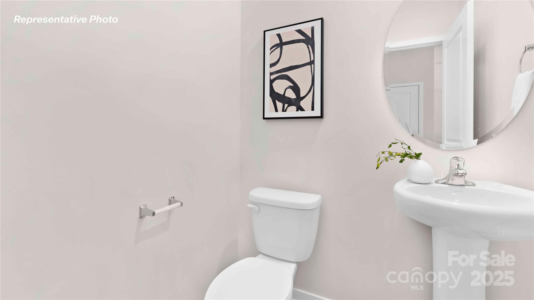 3953 Ashton Drive Northwest Conover, NC 28613 - Photo 25 of 27 a bathroom with a toilet sink and mirror