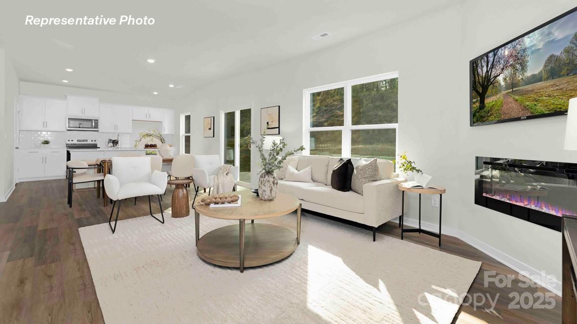 3953 Ashton Drive Northwest Conover, NC 28613 - Photo 3 of 27 a living room with furniture and a flat screen tv