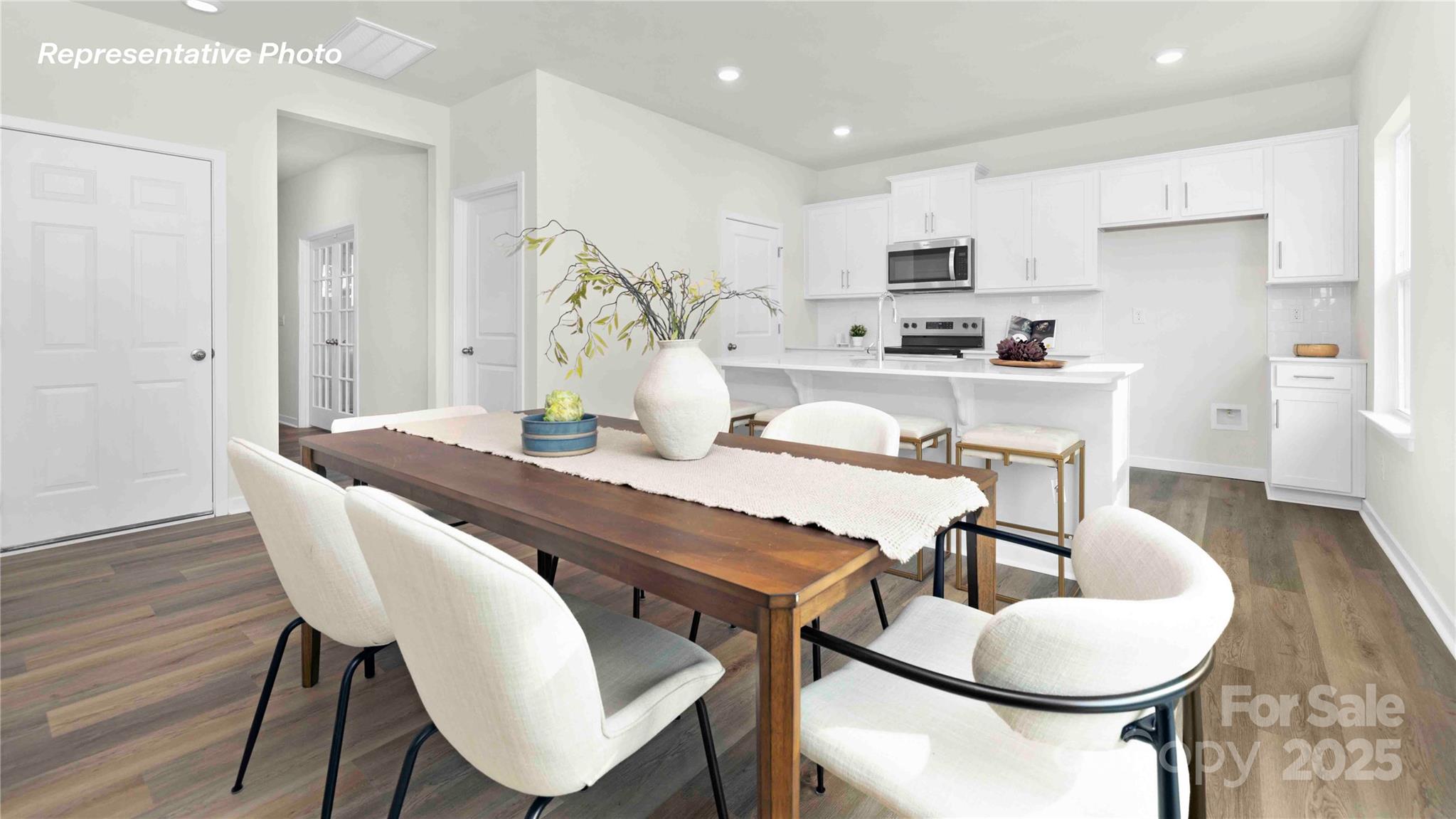 3953 Ashton Drive Northwest Conover, NC 28613 - Photo 6 of 27 a view of a dining room with furniture and wooden floor