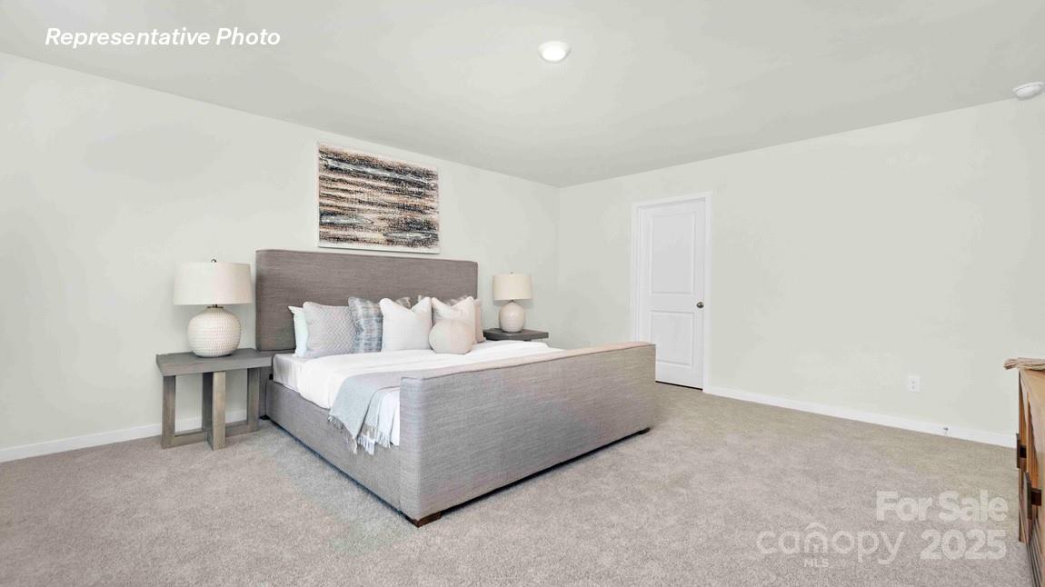 3953 Ashton Drive Northwest Conover, NC 28613 - Photo 8 of 27 a bed room with a bed and a night stand