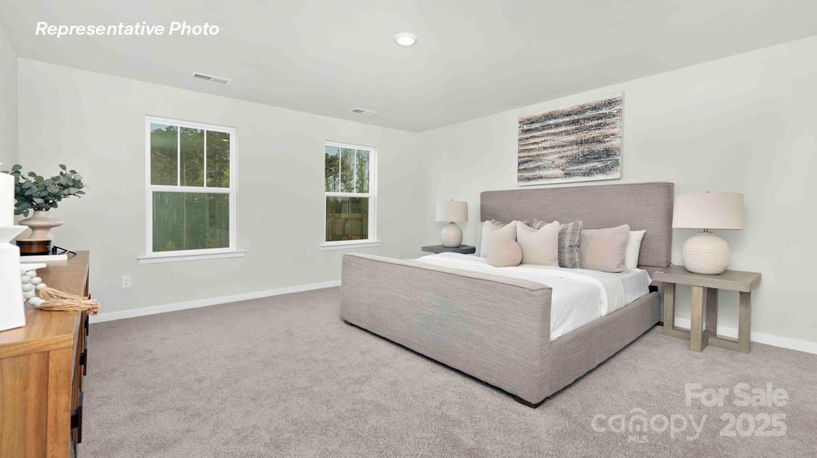 3953 Ashton Drive Northwest Conover, NC 28613 - Photo 10 of 27 a bed room with a bed and three windows