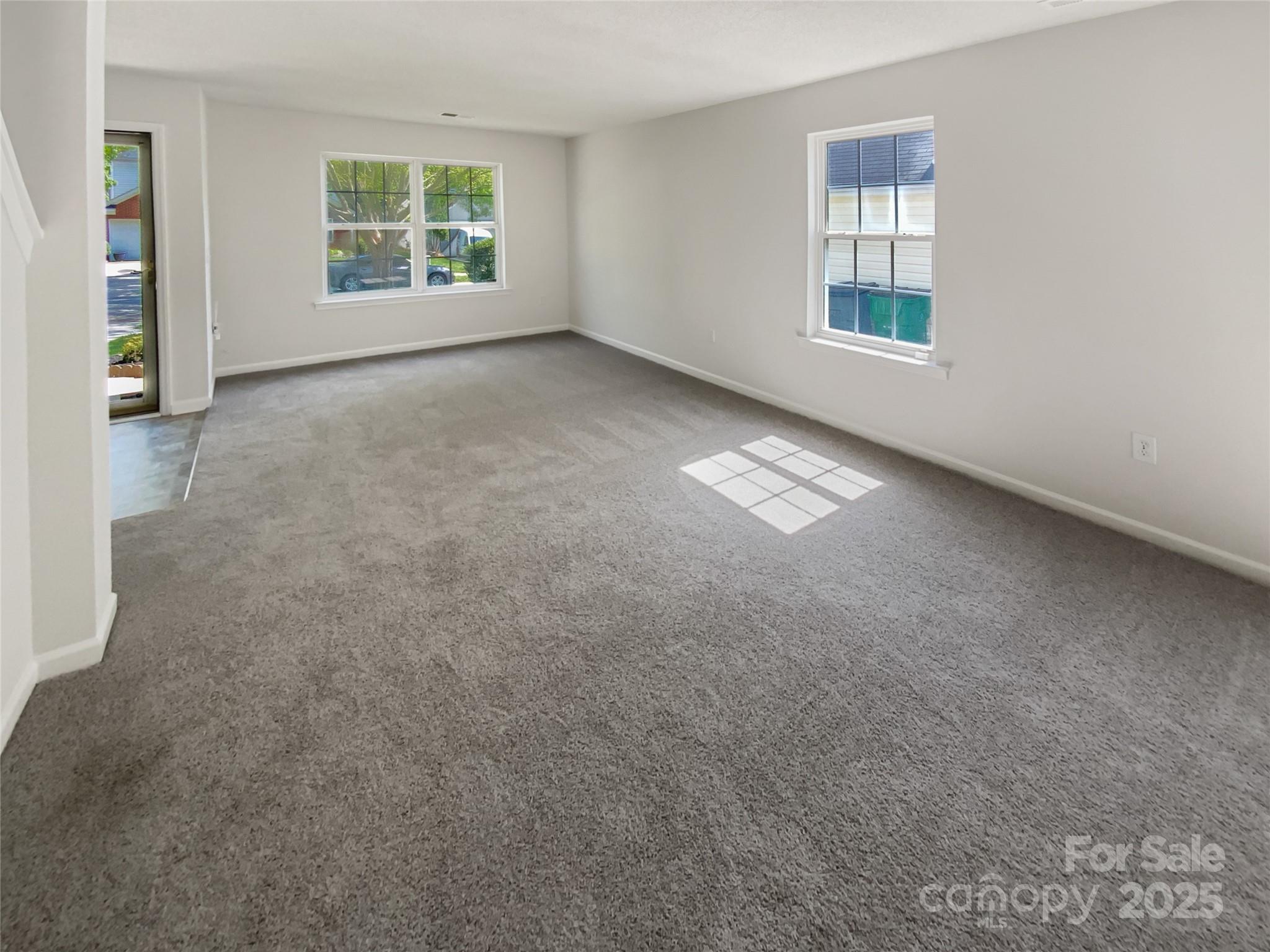 4437 Devonhill Lane Charlotte, NC 28269 - Photo 11 of 18 an empty room with windows