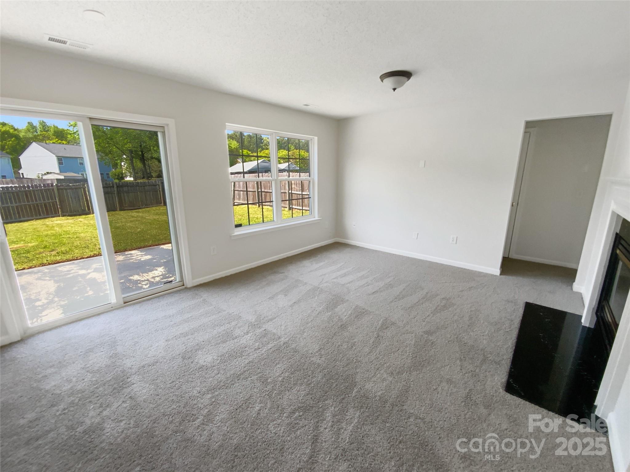 4437 Devonhill Lane Charlotte, NC 28269 - Photo 3 of 18 a view of an empty room with a window