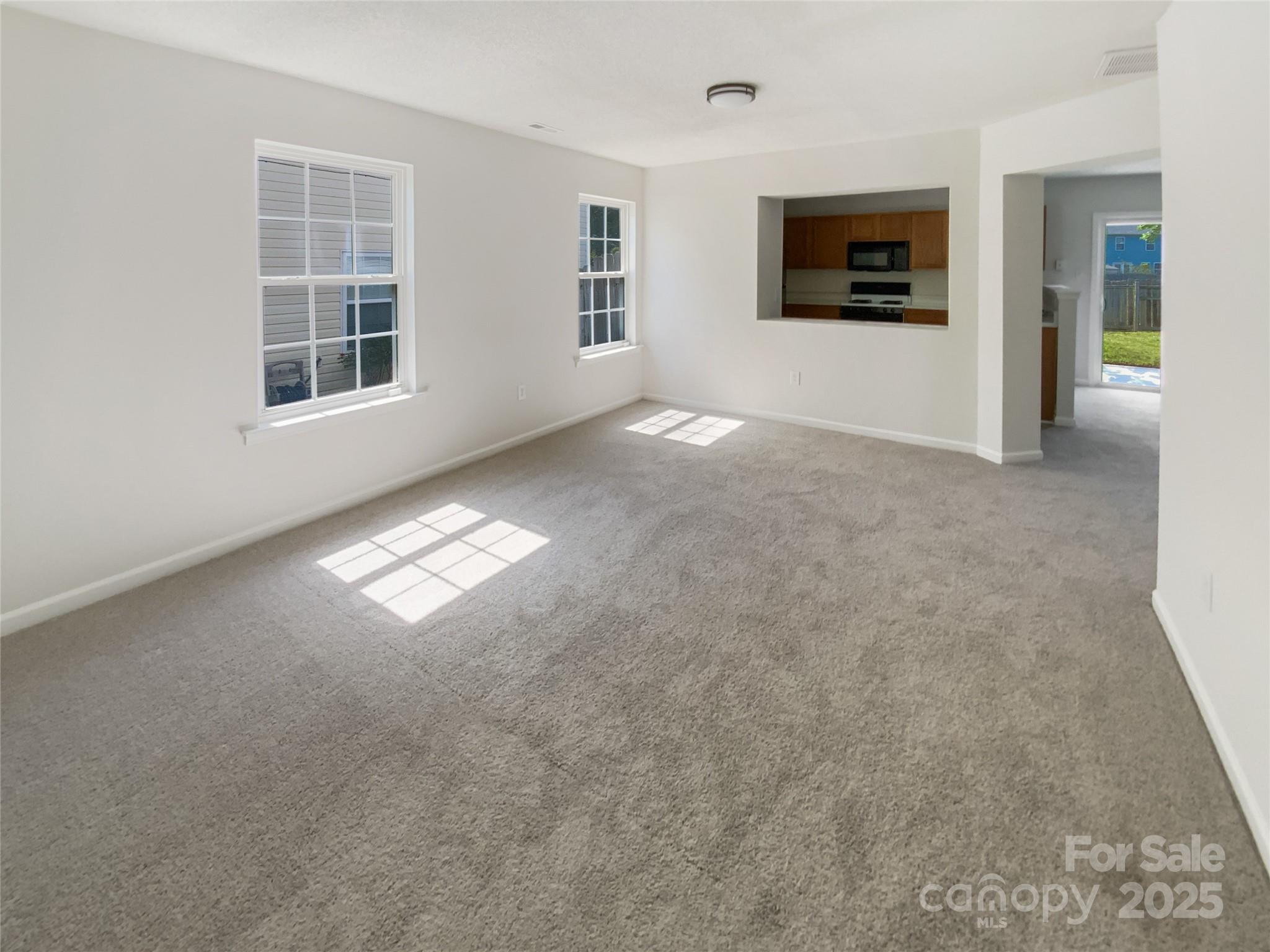 4437 Devonhill Lane Charlotte, NC 28269 - Photo 10 of 18 an empty room with windows