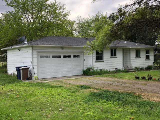 an aerial view of a house with a outdoor space