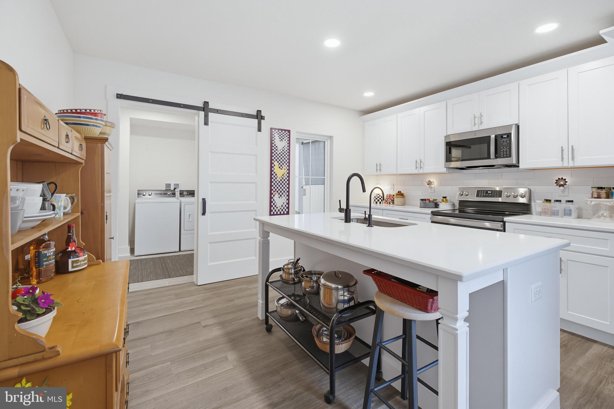 20 Willow Street Lititz, PA 17543 - Photo 11 of 44 a kitchen with stainless steel appliances a sink a stove a refrigerator and cabinets