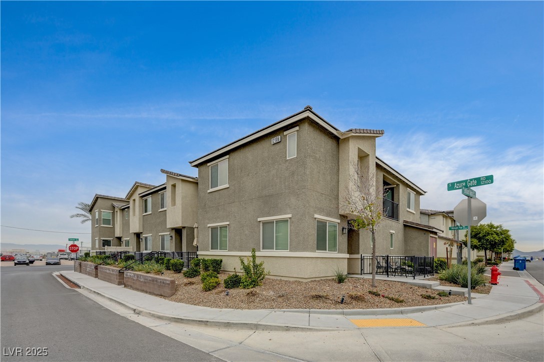 View of side of home with stucco siding