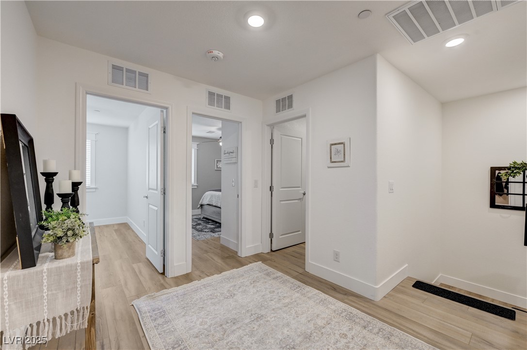 12106 Azure Gate Road, Unit 3 Las Vegas, NV 89183 - Photo 30 of 77 Hallway featuring light wood-style floors and recessed lighting
