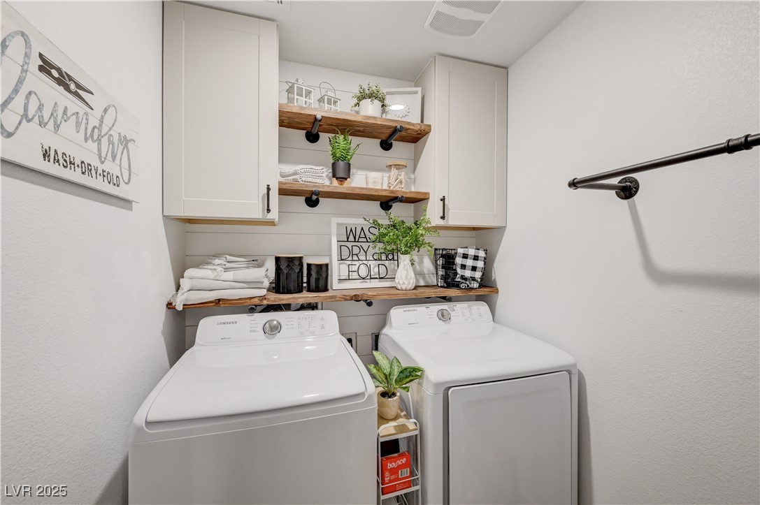 12106 Azure Gate Road, Unit 3 Las Vegas, NV 89183 - Photo 47 of 77 Laundry room featuring washing machine and clothes dryer and cabinet space