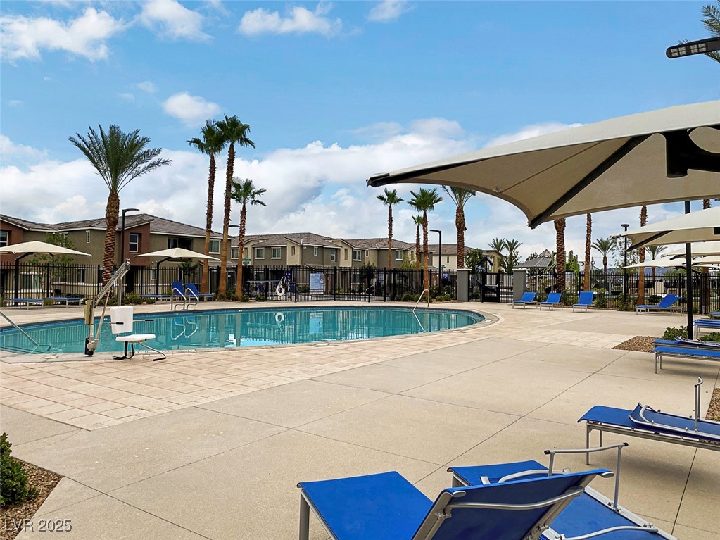 12106 Azure Gate Road, Unit 3 Las Vegas, NV 89183 - Photo 59 of 77 Community pool featuring a residential view and a patio area