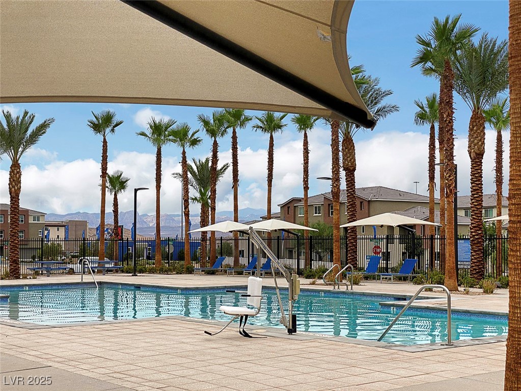 12106 Azure Gate Road, Unit 3 Las Vegas, NV 89183 - Photo 60 of 77 Community pool with a patio