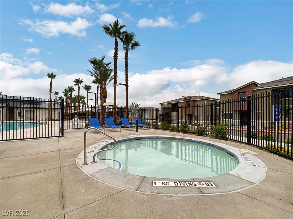 12106 Azure Gate Road, Unit 3 Las Vegas, NV 89183 - Photo 63 of 77 Community pool with a patio area