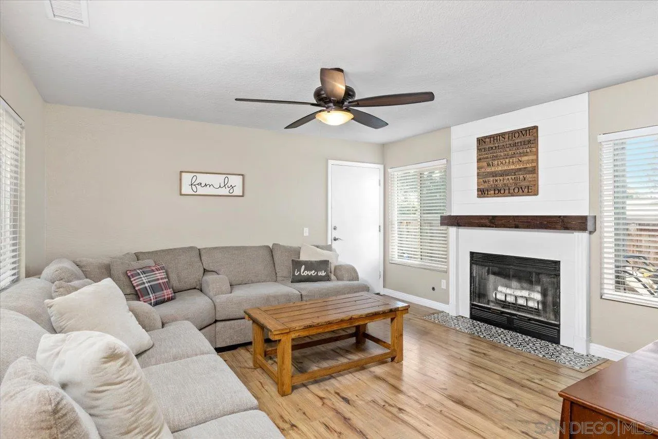 1561 Conway Drive Escondido, CA 92027 - Photo 12 of 41 a living room with furniture and a fireplace