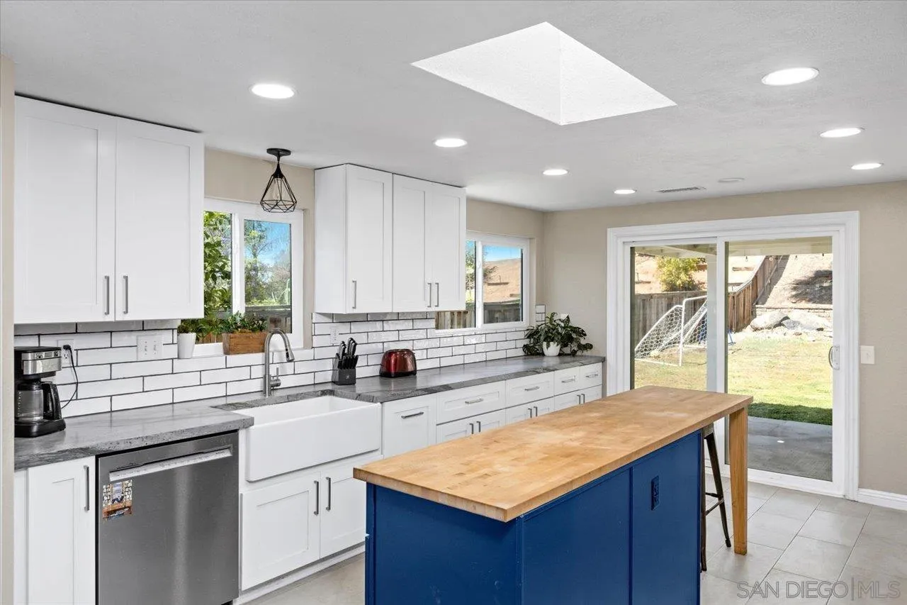 1561 Conway Drive Escondido, CA 92027 - Photo 14 of 41 a kitchen with stainless steel appliances granite countertop a sink window and cabinets