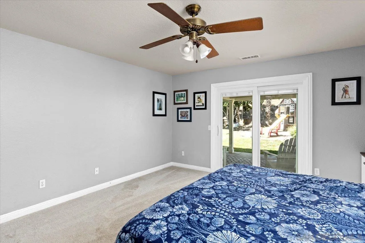 1561 Conway Drive Escondido, CA 92027 - Photo 20 of 41 a bedroom with a bed and a window