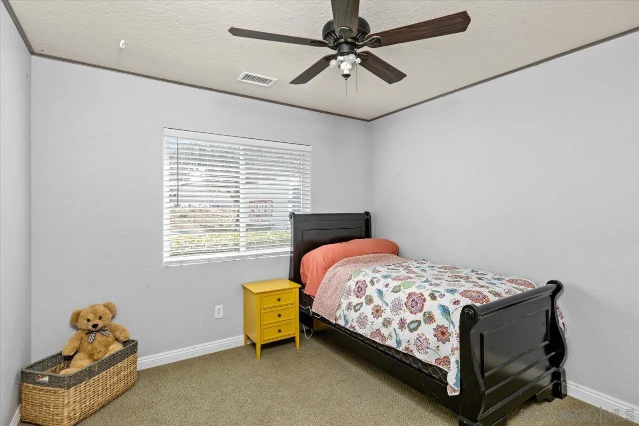 1561 Conway Drive Escondido, CA 92027 - Photo 25 of 41 a bedroom with a bed and a window
