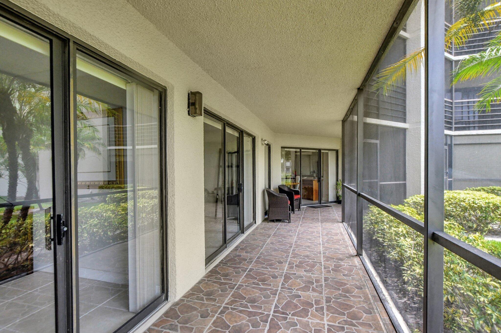 5901 Camino Del Sol, Unit 107 Boca Raton, FL 33433 - Photo 15 of 51 a view of a house with wooden floor