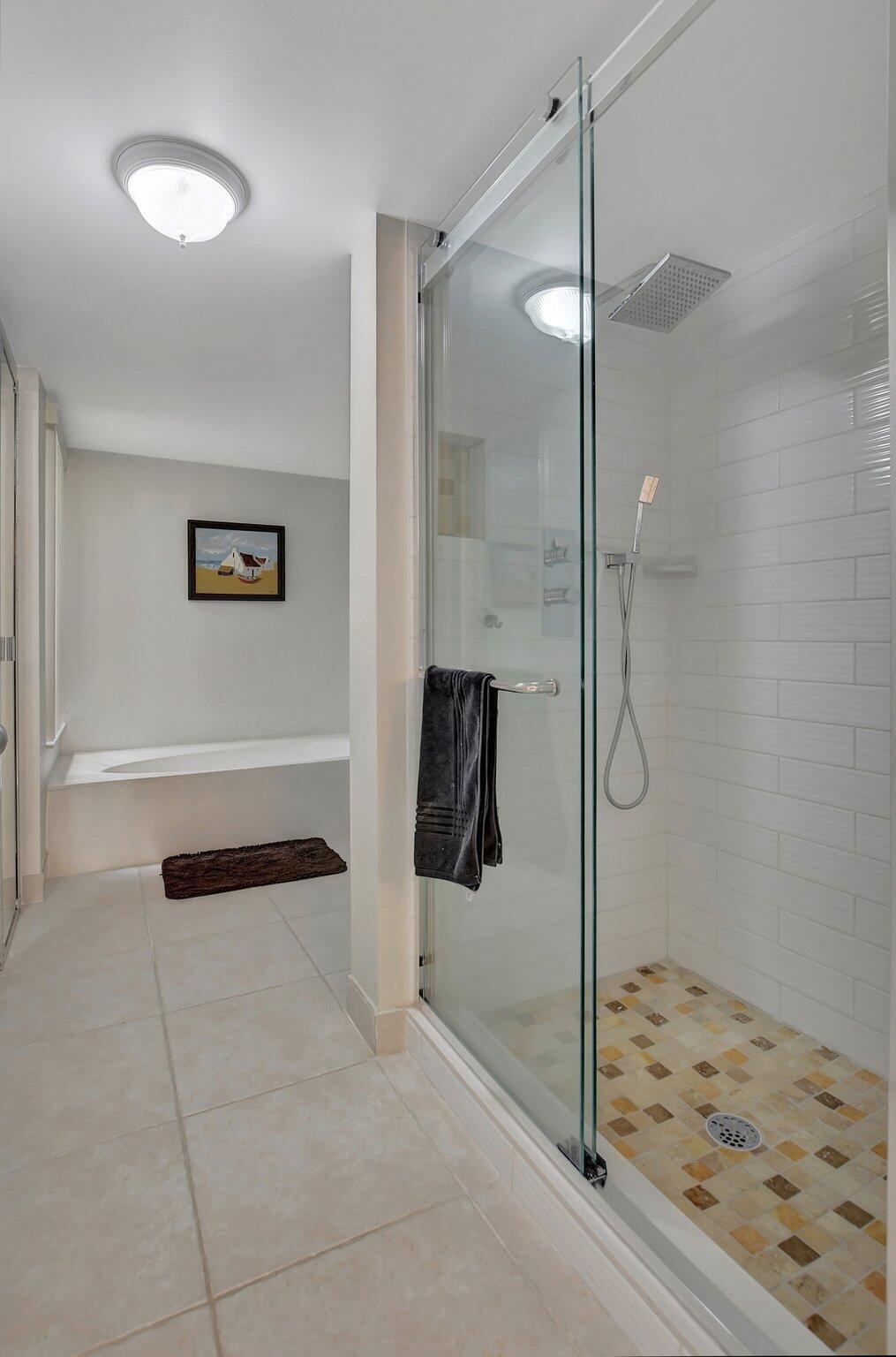 5901 Camino Del Sol, Unit 107 Boca Raton, FL 33433 - Photo 33 of 51 a bathroom with a shower and a sink
