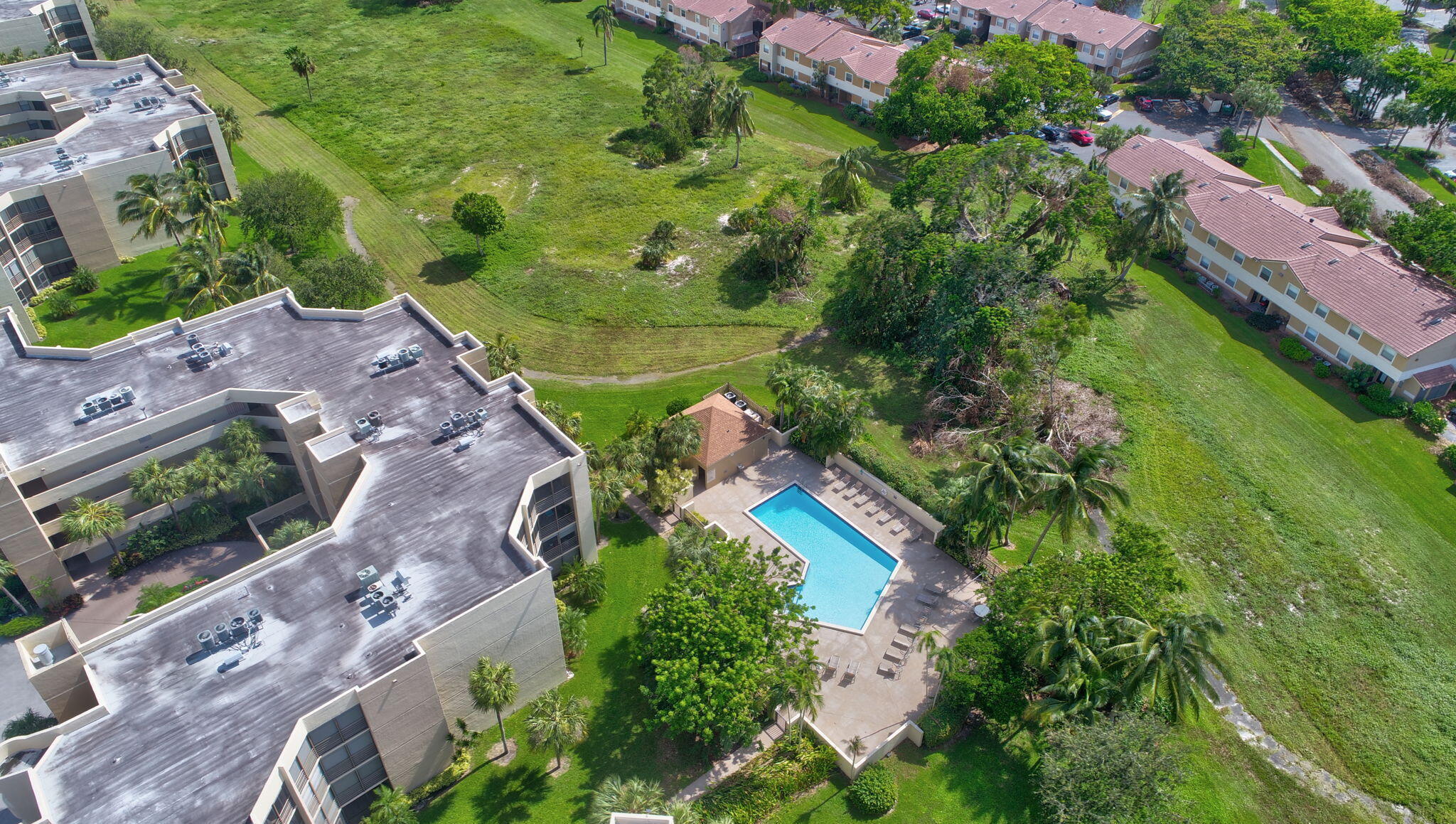5901 Camino Del Sol, Unit 107 Boca Raton, FL 33433 - Photo 44 of 51 an aerial view of residential houses with outdoor space