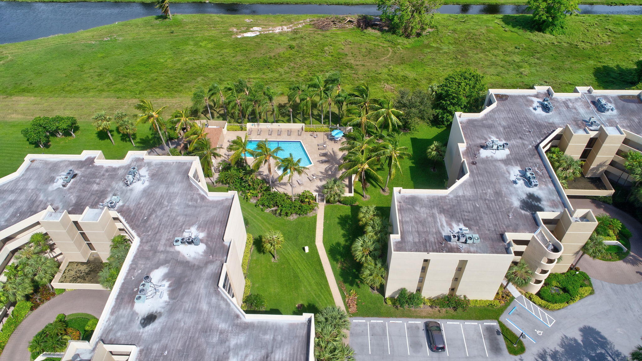 5901 Camino Del Sol, Unit 107 Boca Raton, FL 33433 - Photo 45 of 51 an aerial view of house with a garden