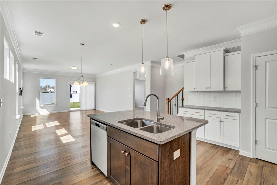 270 Pendergast Road Greenville, SC 29605 - Photo 8 of 43 An inviting open concept living space features a spacious kitchen island and gleaming hardwood flooring.