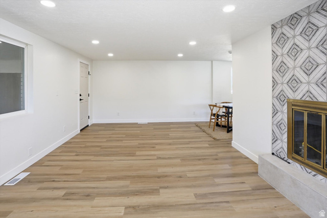 810 East Maple Street Mapleton, UT 84664 - Photo 16 of 49 Spacious room featuring wood-finish flooring, recessed lighting, and a window for natural light