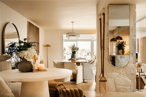 a kitchen with stainless steel appliances kitchen island granite countertop a stove a sink a refrigerator and a wooden floor