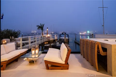 a bedroom with furniture and a large window