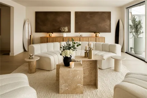 a living room with couches and a large window with outer view