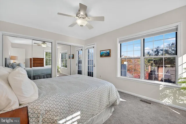 a spacious bedroom with a large bed and a window