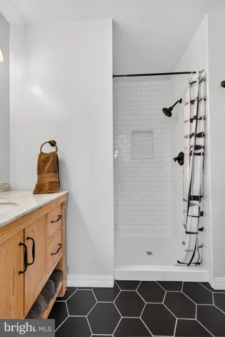 a bathroom with a bathtub and shower