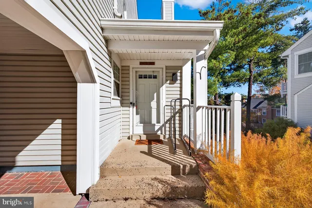 a view of a house with wooden fence
