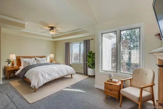a bedroom with a bed and glass window