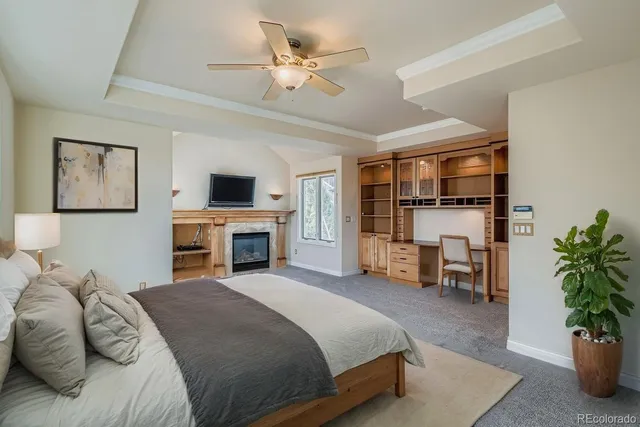 a bedroom with a large bed and a tv