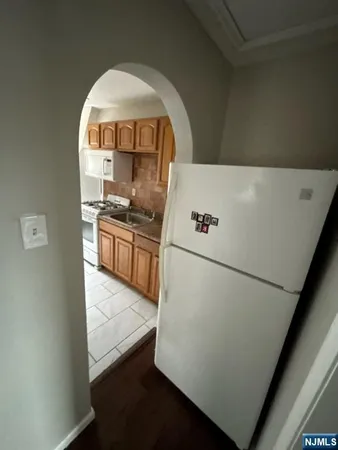 a kitchen with a refrigerator and a stove
