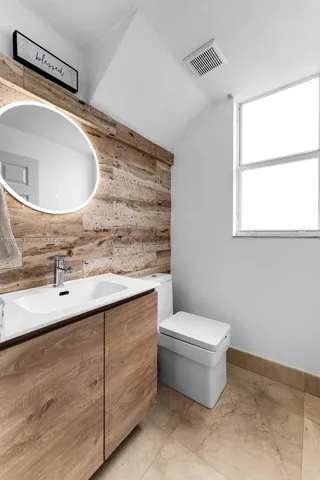 a bathroom with a sink and mirror