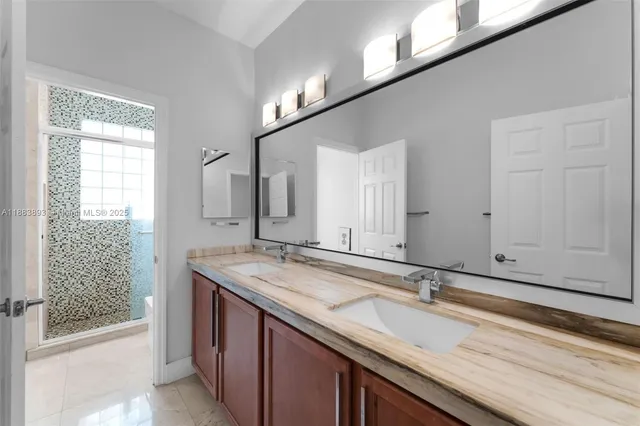 a bathroom with a sink and a mirror