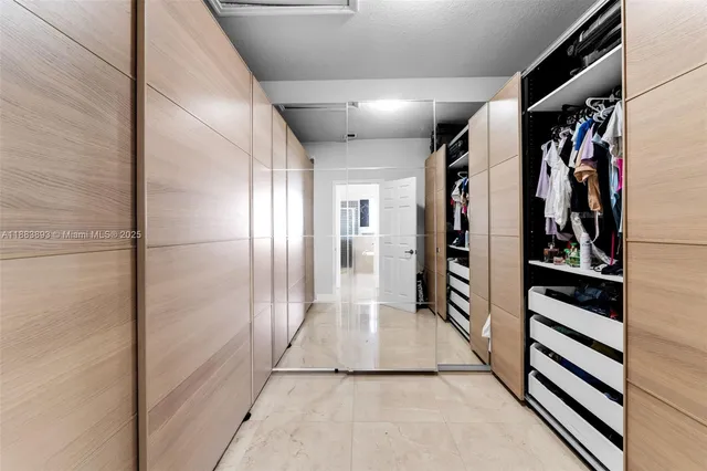 a view of gallery with wooden floor