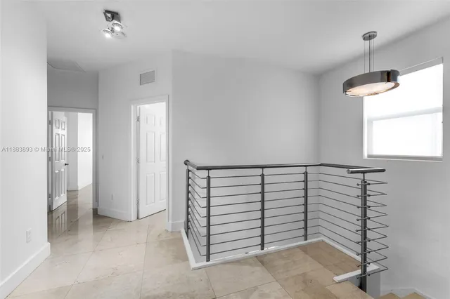 a view of a room with closet and windows