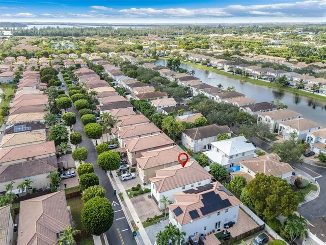 an aerial view of residential houses with outdoor space