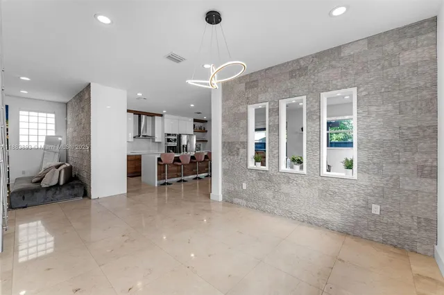 a view of a living room and a large window