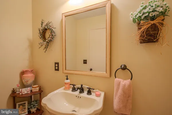 a bedroom with a bed a table and chair