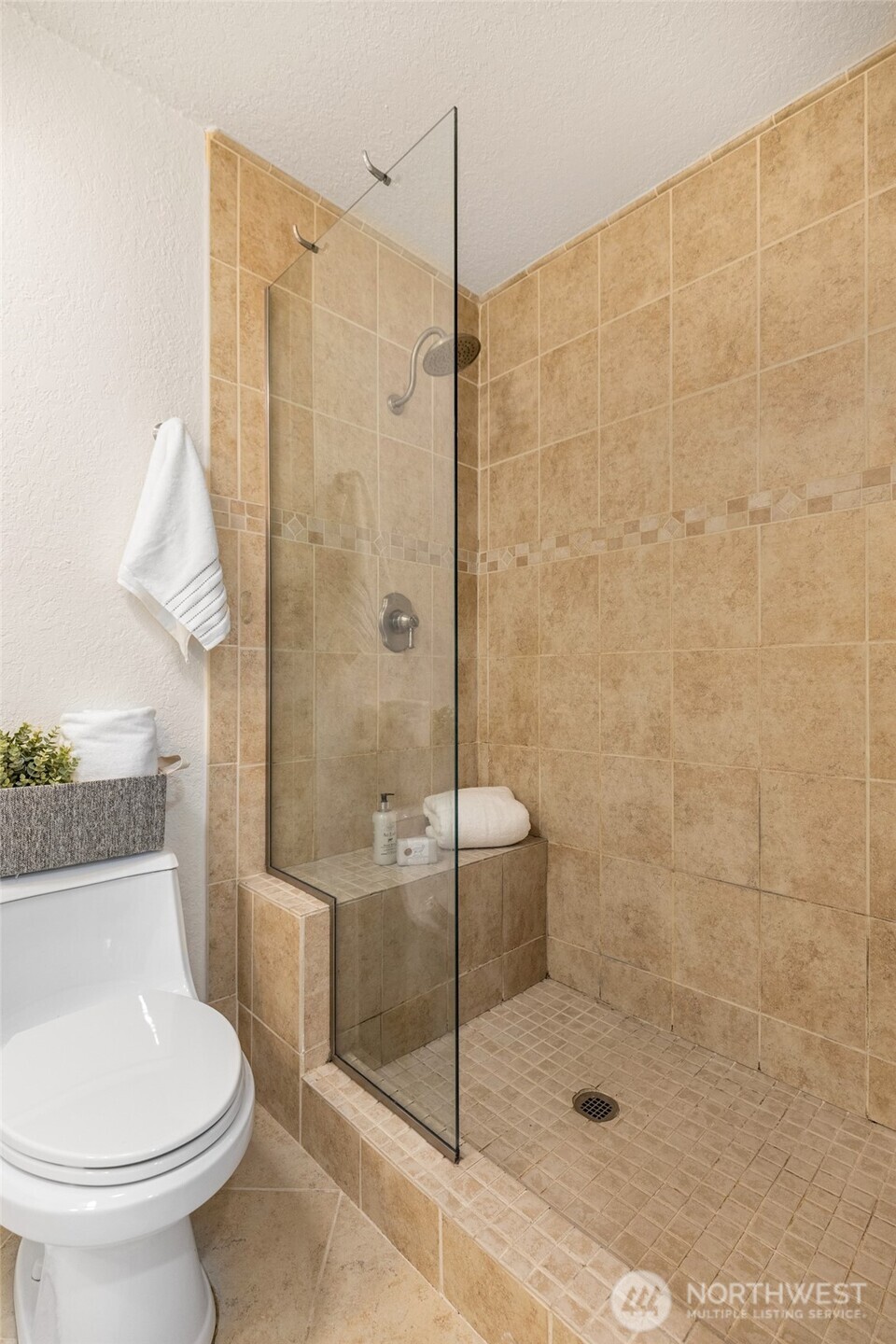 13626 Northeast 7th Street, Unit F10 Bellevue, WA 98005 - Photo 21 of 23 a bathroom with a shower and a toilet