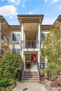 a view of a patio with couches chairs and potted plants
