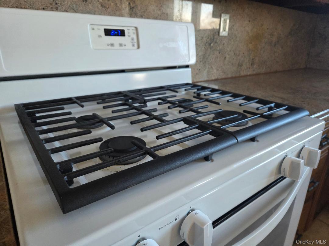 68 Kirkwood Road Port Washington, NY 11050 - Photo 5 of 9 a close up of a stove sitting inside of a kitchen