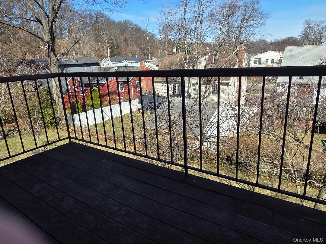 68 Kirkwood Road Port Washington, NY 11050 - Photo 8 of 9 a balcony with wooden floor